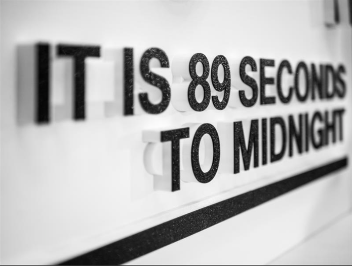 A photo shows a close up view of the text on the Doomsday Clock, which reads, "It is 89 seconds to midnight."